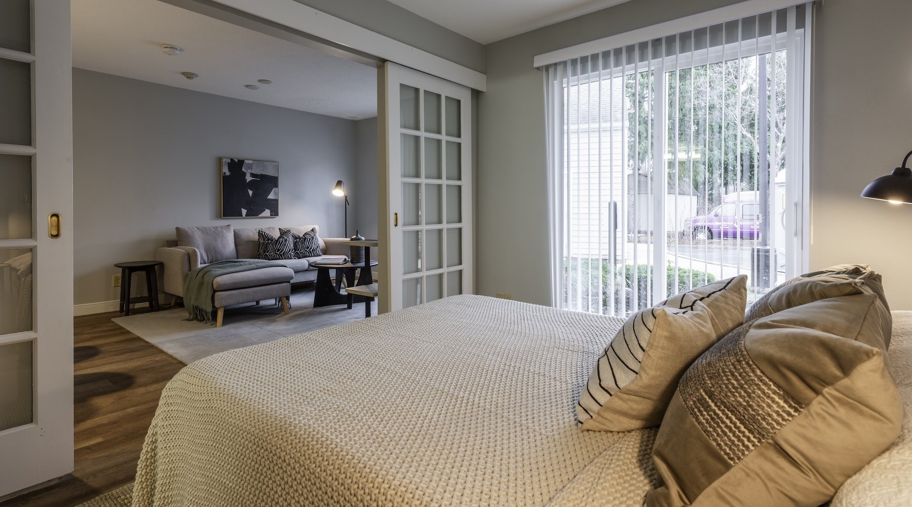 bedroom with bed and view of living room