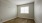 a room with a wood floor and a window