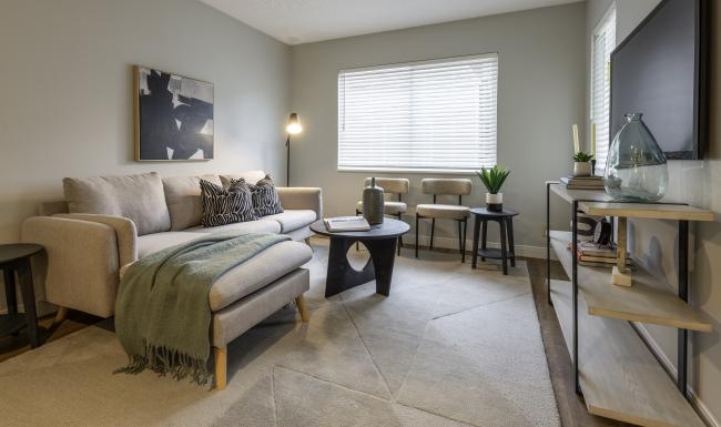 a living room with a couch and a table