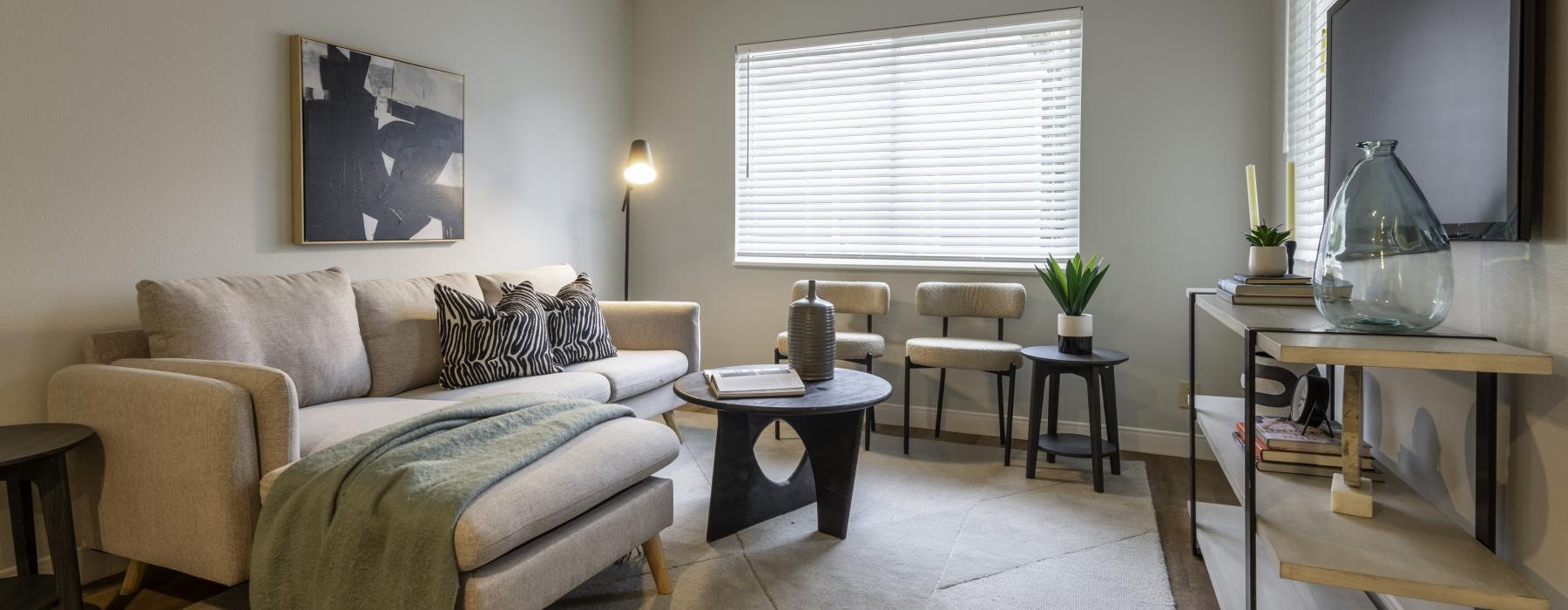 a living room with a couch and a table