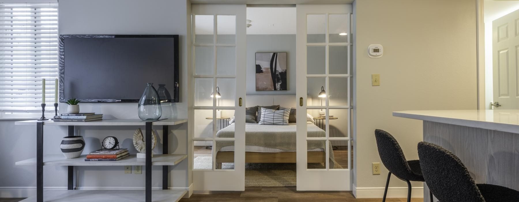 a room with a tv and a table